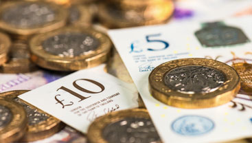 Photograph of different bank notes and coins