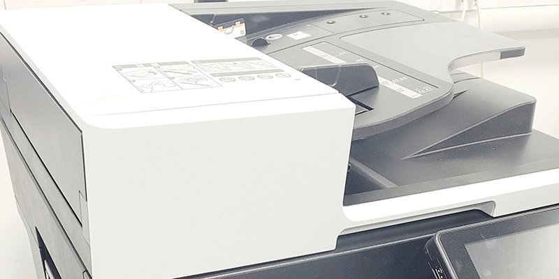 The front and side of a multi-function device used for printing, scanning and copying.