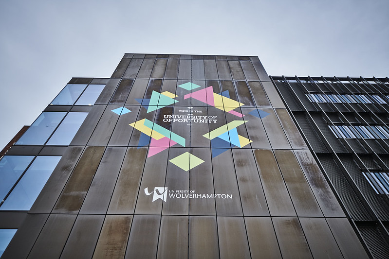 Exterior of the Rosalind Franklin building on Wolverhampton City Campus, text reading THIS IS THE UNIVERSITY OF OPPORTUNITY printed on the side of the building.