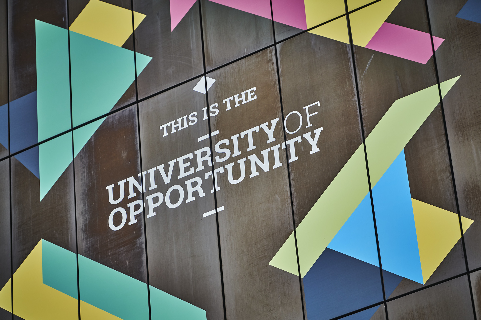 Picture of city campus with a mural saying City of Opportunity and University of Wolverhampton