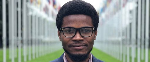 Alumni Toyyib Abdulkareem smiling at camera