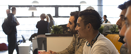 image of students relaxing in a social setting looking happy