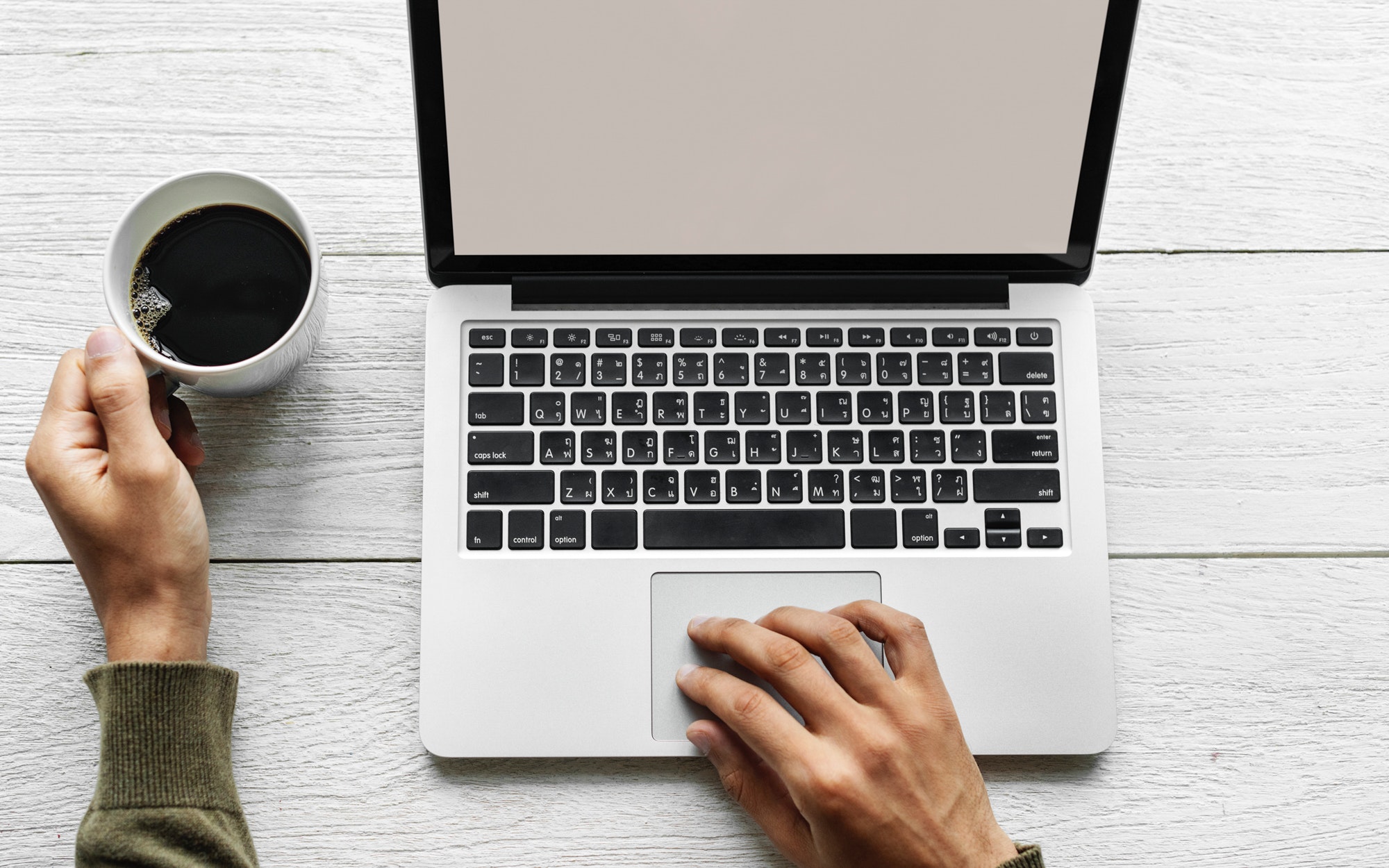 Photograph of a laptop on a desk