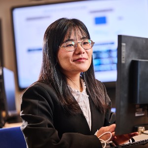 A student operating a desktop computer