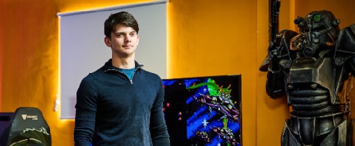 A games design student standing in a development studio