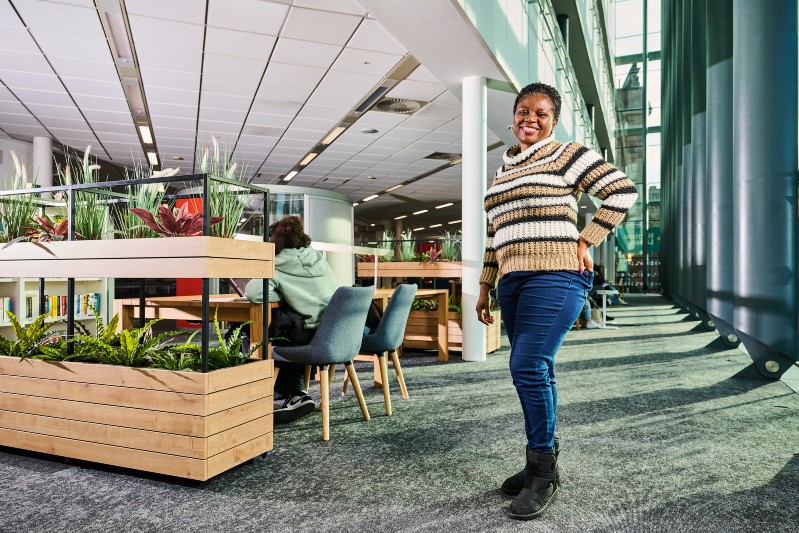 A student standing in the library